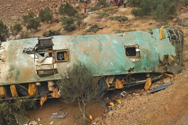 This handout photo released by Arequipa Fire Department showing the accident where at least 35 people were killed when a bus veered off a mountain road and plunged into a ravine on the Pan-American road in southern Peru on Wednesday (AFP photo)