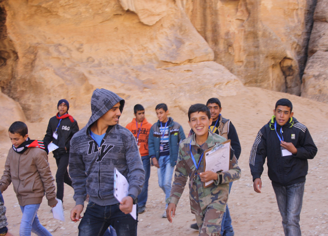 Students in 'Siq Al Barid', also known as 'Little Petra', exploring the archaeological features that closely resemble the main site at Petra, 235km south of Amman, in Maan Governorate (Photo courtesy of UNESCO)