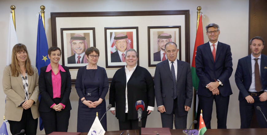 Officials pose for a photo during the signining of an agreement  finance the construction of a greenfield wastewater treatment facility in Al Ghabawi in Amman on Tuesday  (Photo courtesy of Planning Ministry)