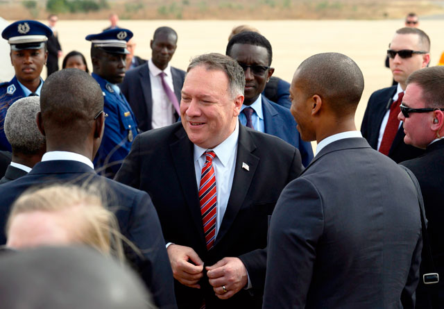 US Secretary of State Mike Pompeo speaks with local officials after arriving at Blaise Diagne International Airport in Senegal on Saturday (AFP photo)