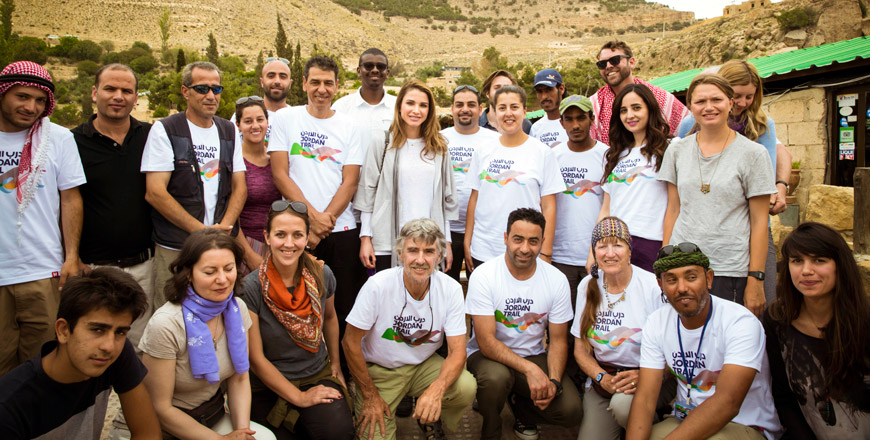 Her Majesty Queen Rania poses for a group photo with Thru Hike participants at Dana Village on Monday (Photo courtesy of the Royal Court)