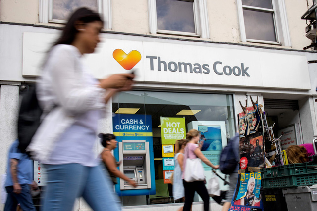 A sign is pictured above a branch of a Thomas Cook travel agent’s shop in London on Tuesday  (AFP photo)
