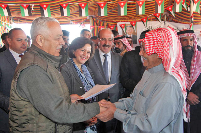 Royal Court Secretary General Yousef Issawi during a ceremony to hand over keys of newly built houses in Maan on Saturday (Petra photo)