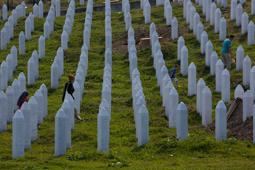 Bosnian people visit graves at memorial centre in Potocari near Srebrenica, 150km northeast of Sarajevo, Bosnia, on Wednesday (AP photo)