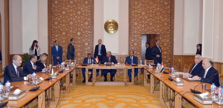 Deputy Prime Minister and Foreign Minister Ayman Safadi, his Iraqi counterpart Fuad Hussein and Egyptian Foreign Minister Sameh Shoukry hold a trilateral meeting in Cairo on Tuesday (Photo courtesy of Foreign Ministry)