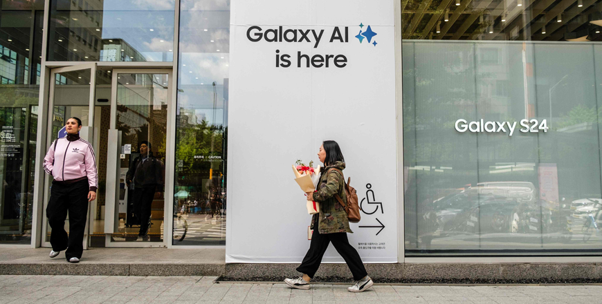 Pedestrians walk outside a Samsung store with signage that reads 'Galaxy AI is here' in Seoul on Wednesday (AFP  photo)