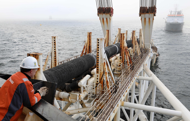 In this photo taken on November 15, 2018, an employee of the Allseas offshore service company works on the ship ‘Audacia’, from where parts of the Nord Stream 2 pipeline are laid in the Baltic Sea off the coast of Laage, northeastern Germany  (AFP file photo)