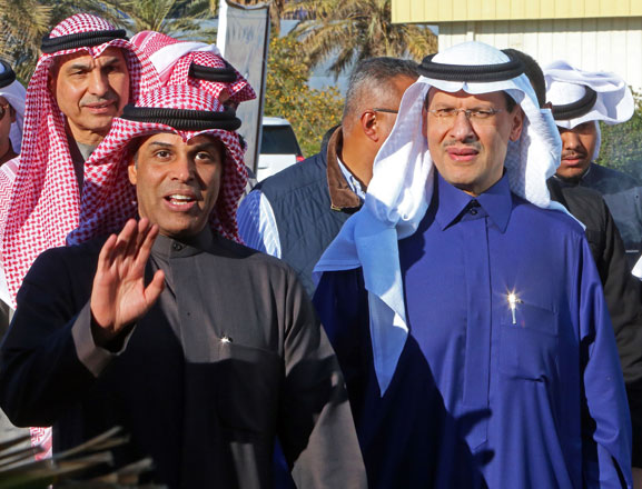   Kuwaiti Oil Minister Khaled Al Fadhel (centre-left) and Saudi Oil Minister Prince Abdulaziz Bin Salman (Centre-right) arrive for a ceremony marking the signing of an agreement to reproduce oil in the neutral zone between the two countries, at Wafra about 100 kilometres south of Kuwait City, on Tuesday  (AFP photo)