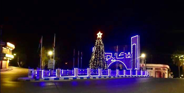 Christmas lights and decorations are seen in a street of Fuheis, some 12km west of Amman, on Christmas Eve, Thursday (Photo by Osama Aqarbeh)
