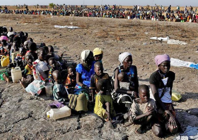 Women and children wait to be registered prior to a food distribution carried out by the United Nations World Food Programme in Thonyor, Leer state, South Sudan, on February 26 (Reuters photo)