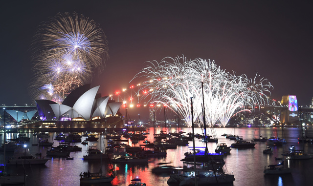 New Year’s Eve fireworks explode over the Harbour Bridge and Opera House during the traditional early family fireworks show held before the main midnight event in Sydney on Monday (AFP photo)