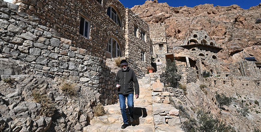 Father Jihad Youssef walks down stairs at Deir Mar Musa, also known as the Monastery of Saint Moses the Abyssinian, in Al Nabk north of Damascus on Saturday (AFP photo)