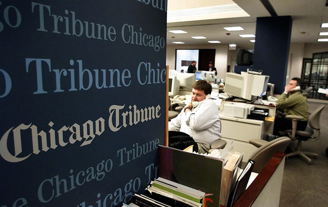 This photo shows employees at the Chicago Tribune sold to a hedge fund on Wednesday (AFP file photo)