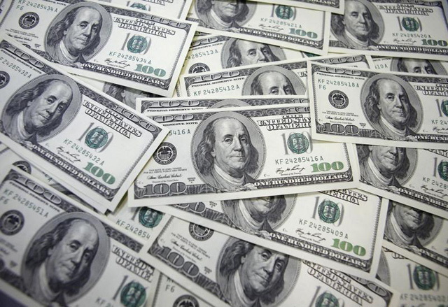 US 100 dollar notes are seen at a bank in this picture illustration in Seoul, on September 20, 2011 (Reuters file photo)