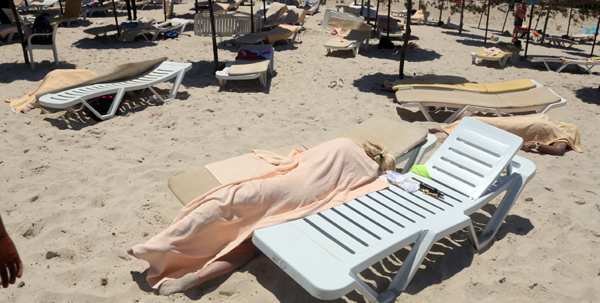 Bodies are covered on a Tunisian beach in Sousse on Friday  (AP photo/Jawhara FM)