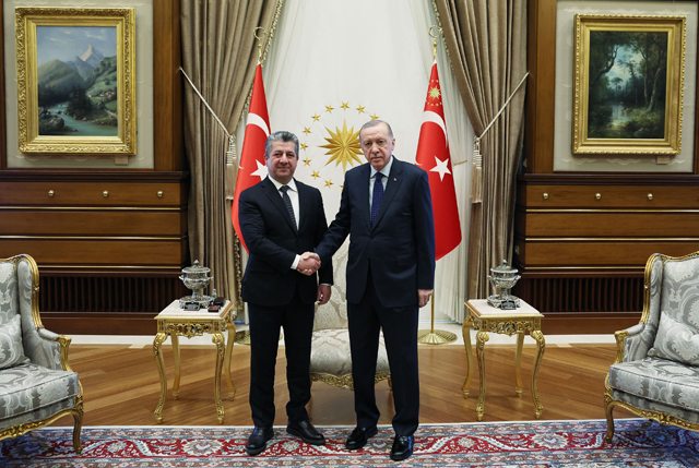 This handout photograph taken and released by Turkish Presidency Press Office on January 7, 2025, shows Turkey's President Recep Tayyip Erdogan (R) shaking hands with Prime minister of Iraq's autonomous Kurdistan Region Masrour Barzani (L) prior to their meeting at the Presidential Complex in Ankara (AFP photo)
