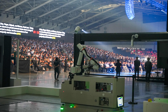 A robotic arm built by Foxconn is seen during the Hon Hai Tech Day in Taipei on Tuesday (AFP photo)