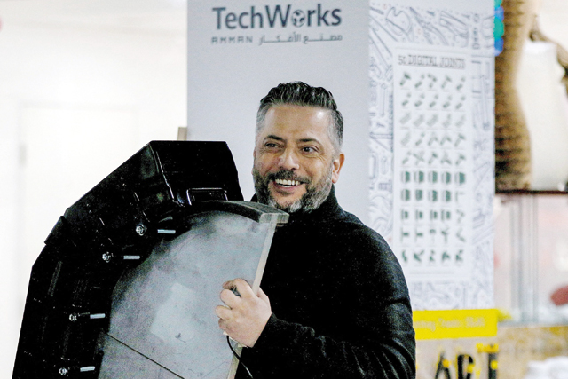 Saliba Taimeh, a 39-year-old Jordanian mechanical engineer and inventor, holds a demo of his ultraviolet radiation sterilisation device during an interview with AFP at the TechWorks digital fabrication lab in Amman on February 20 (AFP photo by Khalil Mazraawi)