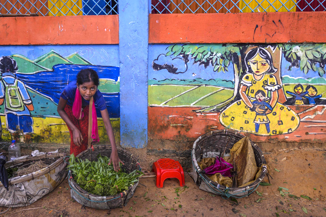 A Rohingya child sells vegetables at Kutupalong refugee camp on Monday (AFP photo)