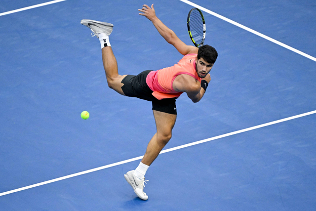 Spain’s Carlos Alcaraz hits a return to Italy’s Jannik Sinner during their men’s singles final match at the China Open tennis tournament in Beijing on Wednesday (AFP photo)