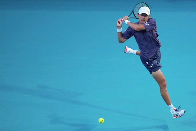Alex de Minaur of Australia returns a shot against Joao Fonseca of Brazil during their match on Day 7 of the Miami Open at Hard Rock Stadium on Tuesday in Miami Gardens (AFP photo)