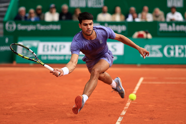 Spain's Carlos Alcaraz plays a forehand return to Italy's Lorenzo Musetti during the Monte Carlo ATP Masters Series Tournament final tennis match at the Monte Carlo Country Club in Roquebrune-Cap-Martin on Sunday (AFP photo)