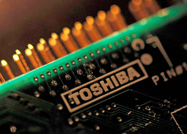 A logo of Toshiba Corp. is seen on a printed circuit board in this photo illustration taken in Tokyo, July 31, 2012 (Reuters file photo)