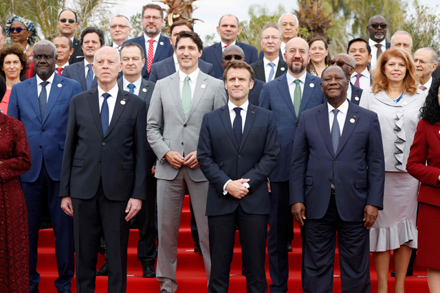 Tunisia's President Kais Saied, Canada's Prime Minister Justin Trudeau, France's President Emmanuel Macron, President of the European Council Charles Michel, Ivory Coast's President Alassane Dramane Ouattara and other heads of Francophone countries pose for a group photo during the 18th Francophone countries Summit in Djerba on Saturday (AFP photo)
