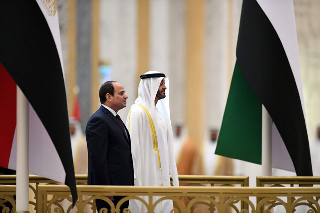 Egyptian President Abdel Fattah Al Sisi and the Crown Prince of Abu Dhabi Sheikh Mohamed Bin Zayed Al Nahyan attend a welcome ceremony in the Emirati capital's Al Watan presidential palace, on Thursday, in Abu Dhabi (AFP photo)