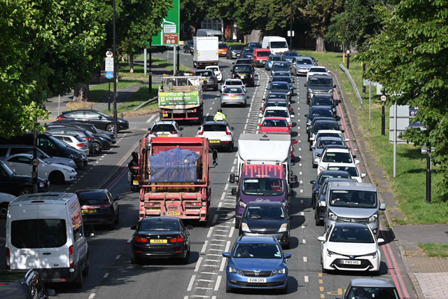 Cars queue in traffic in Twickenham as commuters make their way to London on Tuesday amid the biggest rail strike in over 30 years to hit the UK  (AFP photo)