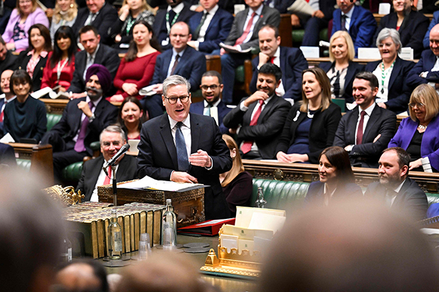 A handout photograph, released by the UK Parliament, shows Britain's Prime Minister Keir Starmer speaking during Prime Minister's Questions (PMQ) session in the House of Commons, in central London on Wednesday (AFP photo)