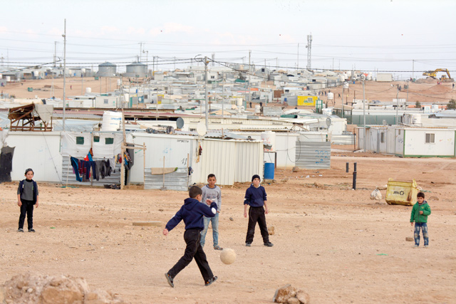 Children are seen playing at Zaatari Syrian refugee camp in Mafraq Governorate, some 80 kilometres northeast of Amman, in this photo dated January 28, 2018 (Photo by Amjad Ghsoun)