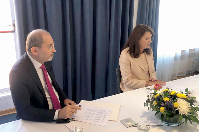 Deputy Prime Minister and Foreign Minister Ayman Safadi, Swedish counterpart Ann Linde and UNRWA Commissioner General Philippe Lazzarini (not seen) attend a meeting in Madrid on Monday (Photo courtesy of Foreign Ministry)