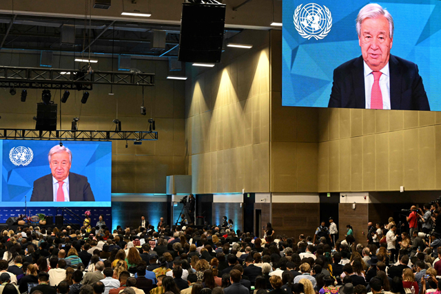 UN Chief Antonio Guterres message is projected on big screens during the opening ceremony of the COP16 summit in Cali, Colombia on Sunday (AFP photo)