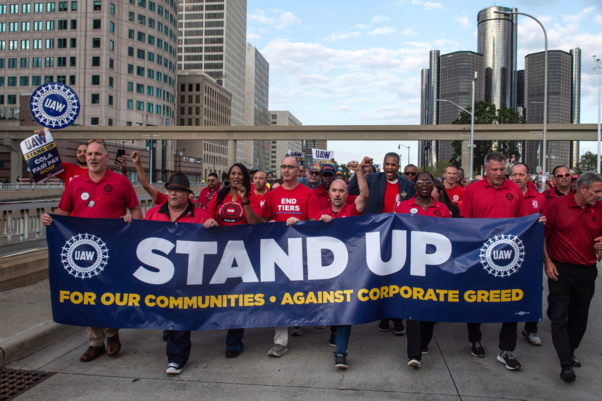 Members of the United Auto Workers (UAW) union march through the streets of downtown Detroit following a rally on the first day of the UAW strike in Detroit, Michigan, on Friday (AFP photo)