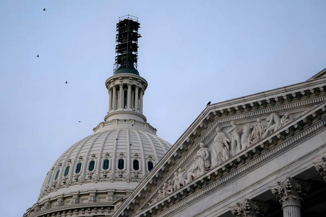 The US Capitol is seen at sunrise on Saturday in Washington, DC. The government is expected to enter a shutdown at midnight if a last-minute budget deal is not reached by the House on Saturday (AFP photo)