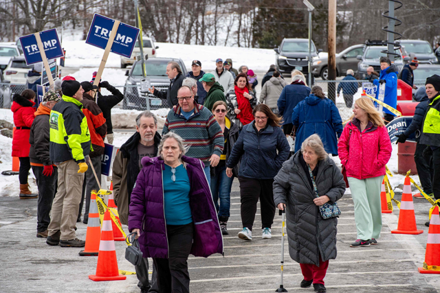 People arrive to vote at a polling station at the Pinkerton Academy in Derry, New Hampshire, on Tuesday (AFP photo)
