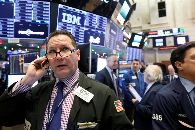 Traders work on the floor of the New York Stock Exchange in New York, US, on Wednesday  (Reuters photo)