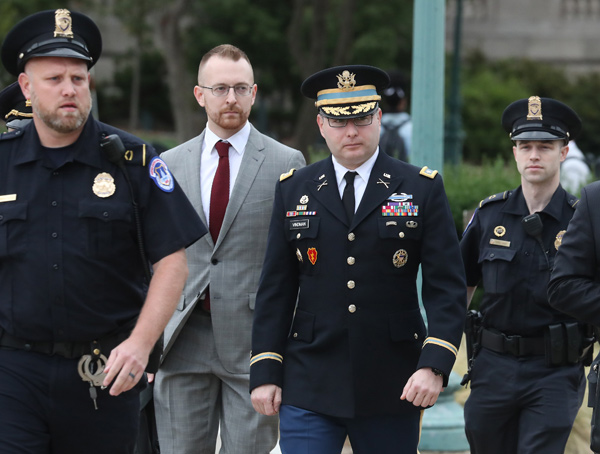 Lt. Col. Alexander Vindman (centre), director for European Affairs at the National Security Council, arrives at the US Capitol on Tuesday in Washington, DC (AFP photo)