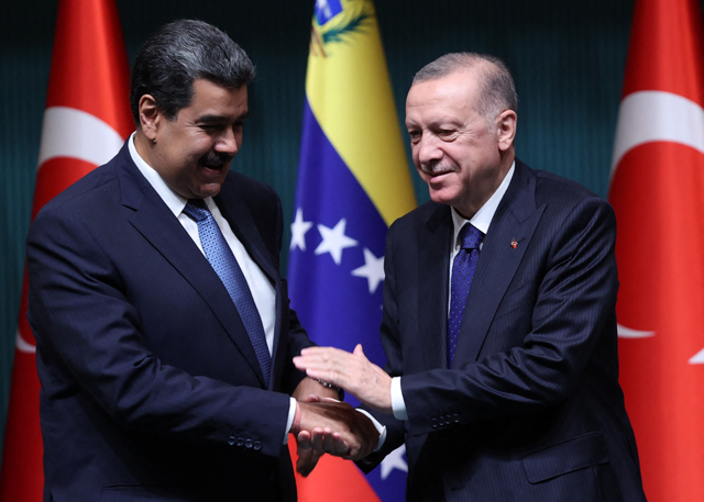 Turkey's President Recep Tayyip Erdogan shakes hand with his Venezuelan counterpart Nicolas Maduro during a joint press conference after their meeting in Ankara on Saturday (AFP file photo)