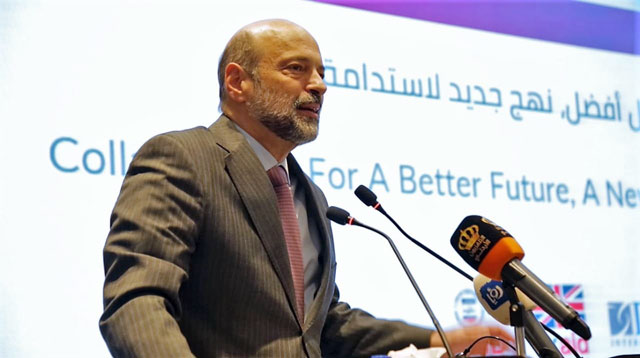   Prime Minister Omar Razzaz delivers a speech during a ‘We Love Reading’ conference on Tuesday (Petra photo)