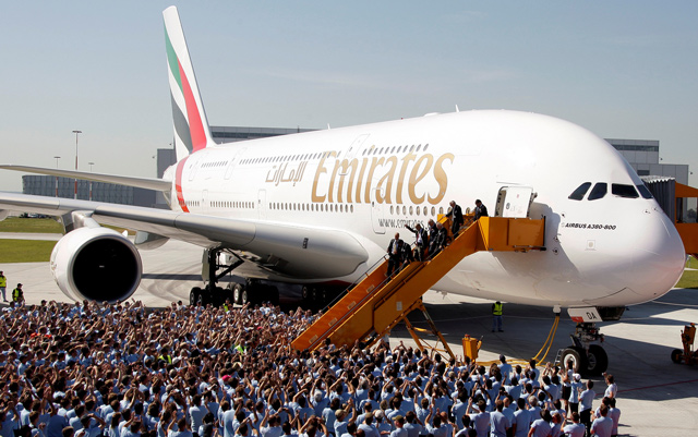 Airbus CEO Tom Enders, Sheikh Ahmed Bin Saeed Al Maktoum, chairman and chief executive of Emirates Airlines Group, and Louis Gallois, CEO of European Aeronautic Defence and Space Company, disembark from an A380 aircraft during a handover ceremony in Hamburg, on July 28, 2008 (Reuters file photo)