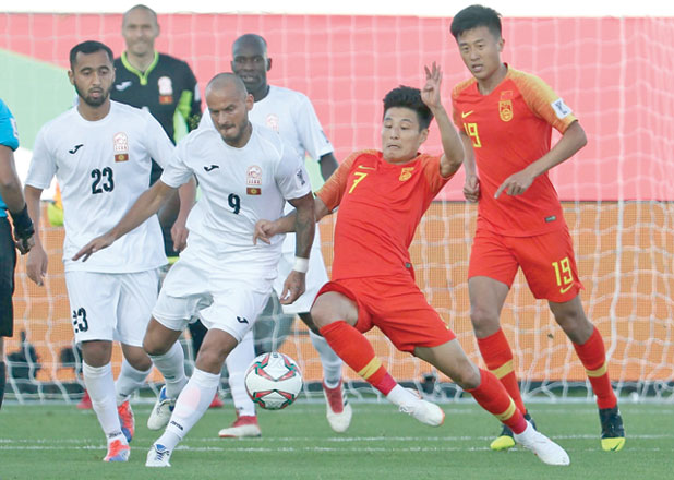 China's midfielder Wu Lei (right) fights for the ball with Kirgyzstan's midfielder Edgar Bernhardt during the 2019 AFC Asian Cup football match between Kyrgyzstan and China at the Khalifa Bin Zayed Stadium on Monday (AFP photo)