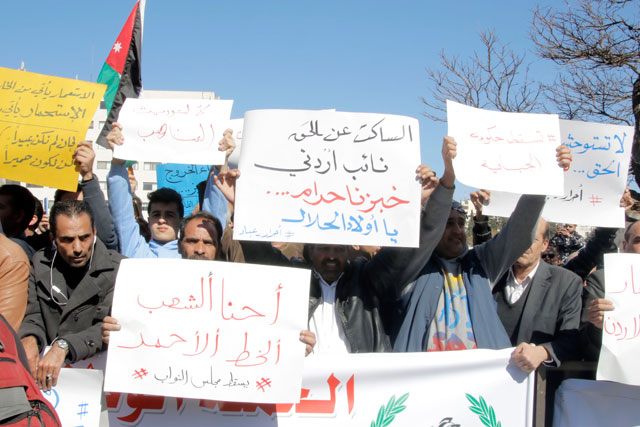 Protesters call for Parliament’s dissolution in light of recent tax increase in Amman on Thursday (Photo by Osama Aqarbeh)