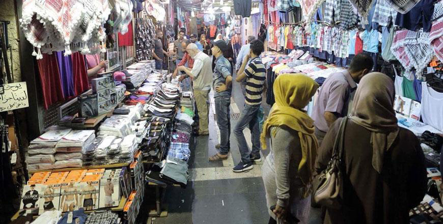 In this undated photo, shoppers are seen in Amman’s downtown. The Textile and Readymade Clothes Syndicate has called on the government to lower taxes on imported clothes, citing economic conditions and high tariffs  (JT file photo)