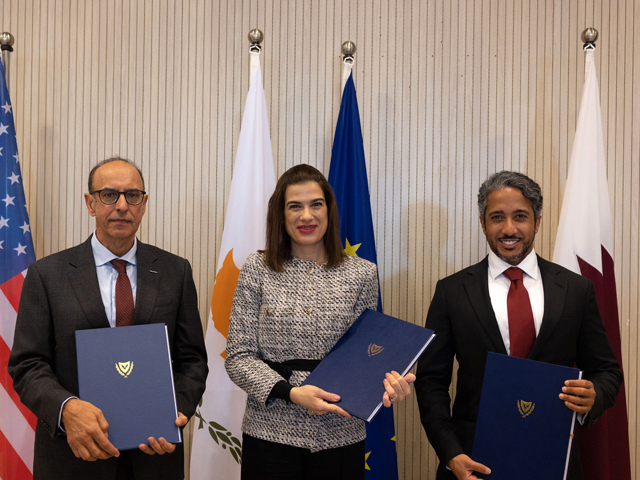 This photo shows Cyprus' Minister of Energy, Commerce and Industry Natasa Pilides with Qatar Energy's Ali Al Mana (right) and Varnavas Theodossiou, a lead country manager for ExxonMobil in Cyprus sharing a photo, after signing a contract on Hydrocarbons exploration in Block 5 of the Exclusive Economic Zone of the east Mediterranean island with the consortium of ExxonMobil and Qatar, on Friday (AFP photo)