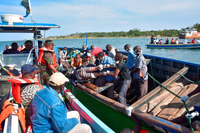 Rescue workers retrieve a body of a woman from the water after a ferry overturned off the shores of Ukerewe Island on Lake Victoria, Tanzania, on Friday  (Reuters photo)