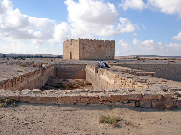 In this photo from 2014, Qala‘at Qatrana fort and water reservoirs (in the foreground), can be seen. The fort was built in 1559 by order of Sultan Suleiman the Magnificent on the Ottoman Darb al Hajj in Southern Jordan (Photo courtesy of  Claudine Dauphin)