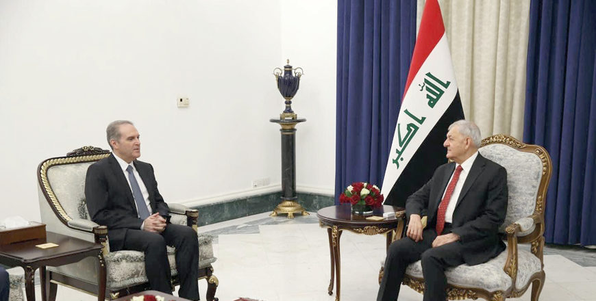 Iraq's President Abdul Latif Rashid meets with Jordan's Minister of Health Firas Al Hawari in Baghdad on Sunday (Petra photo)
