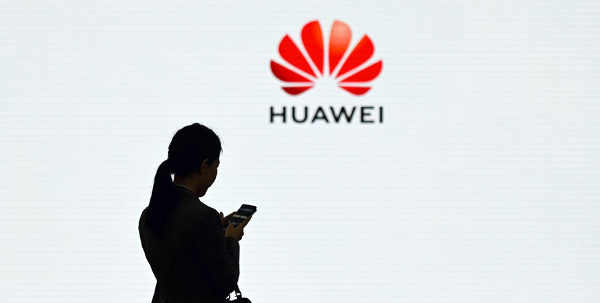   In this photo taken on March 6, 2019, a Huawei staff member uses her mobile phone at the Huawei Digital Transformation Showcase in Shenzhen, in China’s Guangdong province. British Prime Minister Theresa May has given the go-ahead for China’s Huawei to help build a 5G network, shrugging off security warnings from senior ministers and Washington, the Daily Telegraph reported, on Wednesday (AFP file photo)